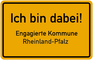 Gelbes Ortsschild mit der Aufschrift „Ich bin dabei - Engagierte Kommune Rheinland-Pfalz“